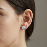Woman wearing the S925 moissanite round halo stud earring in sterling silver