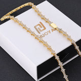 Zirconia tennis chain necklace styled with pendant necklace for layering