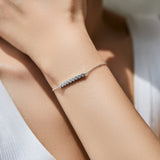 Side profile showing clean lines and precise stone setting on silver bracelet