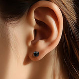 Side profile showing thickness and post detail of black moissanite studs