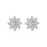 Lifestyle image: earrings styled with a cream turtleneck and gold watch