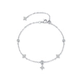 Sterling silver four-leaf clover bracelet worn on wrist for scale and fit