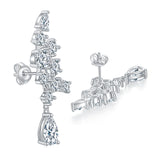 Lifestyle image of earrings worn on a model's ear with soft natural lighting and neutral backdrop