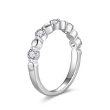 Lifestyle image of the ring on a hand holding a coffee cup—casual daytime aesthetic