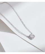 Close-up of solitaire stone setting and prong detail