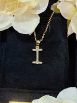 I letter pendant styled with layered necklaces for modern stacking effect