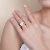 Lifestyle image of ring on wrist with casual linen sleeve and coffee cup