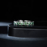Stacked view: FITINY blue-green ring layered with thin gold and silver bands
