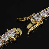 Close up of 18K gold plated box clasp on iced out tennis chain bracelet with round cubic zirconia stones, hip hop jewelry hardware detail shot, bling bracelet craftsmanship