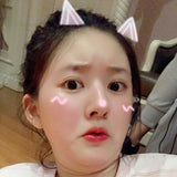 Overhead flat lay with necklace arranged on textured neutral fabric