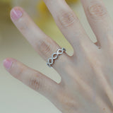 Lifestyle image of the ring worn on hand with neutral-toned outfit and soft focus background