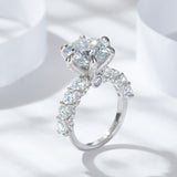 Top-down lifestyle shot of Sparkle Burst Ring on a marble surface with soft lighting