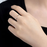 Close-up of two round brilliant moissanite stones set in 18K gold-plated sterling silver