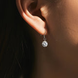 Side profile showing earring depth and sterling silver post construction
