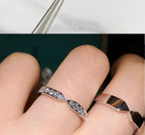 Micro detail of moissanite facet reflection and silver base contrast