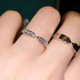 Top-down lifestyle shot of both rings placed on a linen napkin