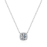 Necklace worn at clavicle level on model with neutral top