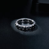 Close-up detail of three black moissanite stones with 3EX cut precision and white gold setting
