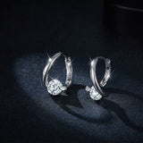 Side profile showing geometric circle shape and moissanite stone depth
