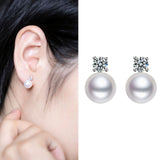 Side profile showing pearl shape and moissanite stone setting