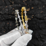 Tennis chain necklace draped over folded denim jacket for texture contrast