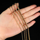 Gold 3mm rope chain necklace on model's neck, front angle
