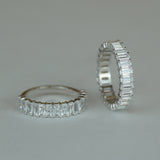 Stack ring styled on hand with neutral-toned clothing for office-chic lifestyle context