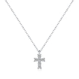 Close-up of pavé-set zirconia stones on minimalist cross pendant