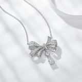 Necklace worn on model at collarbone level, natural lighting