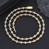 Overhead shot of tennis chain set displayed on velvet jewelry tray