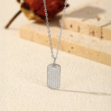 Sterling silver square pendant necklace styled on a model's collarbone