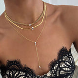 Necklace worn on model with relaxed collarbone fit and layered styling context