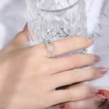 Stacked styling: FITINY moissanite ring layered with two thin gold bands