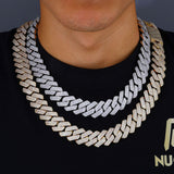 Close-up of cubic zirconia stones embedded in gold Cuban chain links