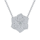 Side profile of camellia pendant highlighting dimensional petal structure and white gold plating