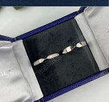 Back view of both rings highlighting smooth inner band contours