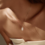 Close-up of moissanite-studded square pendant surface highlighting sparkle and craftsmanship