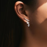 Side angle showing teardrop silhouette and delicate stone detailing