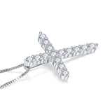 Top-down flat lay of necklace with branding box and styling props