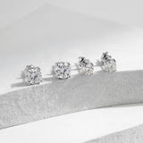 Lifestyle shot of earrings worn on model's ear with minimalist outfit