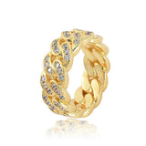 Top-down close-up of zirconia-studded Cuban link pattern on gold ring