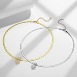 Detail shot highlighting electroplated white gold finish and polished chain links