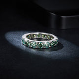 Close-up of moissanite's blue-green hue and brilliant facet pattern under natural light