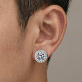 Magnetic moissanite round halo stud earring worn on a man's ear — sharp macro close-up