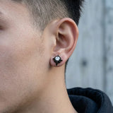 Close-up of Multicolor Stainless Steel Magnetic 4-Pointed Star CZ Stud Earrings on ear
