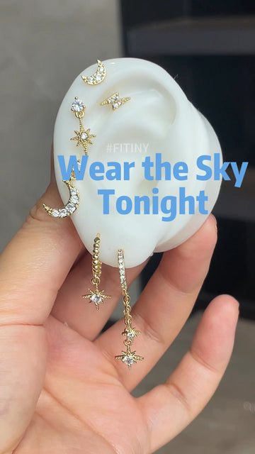 Gold Celestial Star and Moon Earring Set on Display