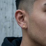 Close-up of Stainless Steel Magnetic Princess Cut CZ Stud Earrings on ear