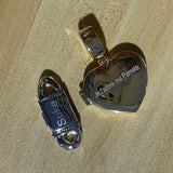 Model wrist wearing stacked gold and white gold geometric bracelets