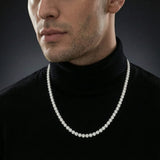 Man wearing a 2mm iced out moissanite tennis chain necklace