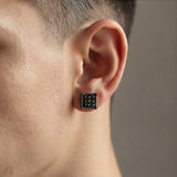 Man wearing a black magnetic square CZ stud earring